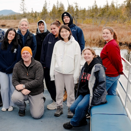 Group on a pontoon boat at raquette lake